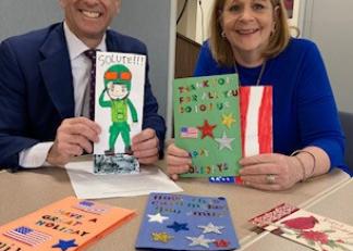 Commissioner Frank Edelblut joins Laura Landerman-Garber, founder of Holiday Cards 4 Our Military.