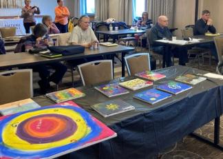 Silver Retreat participants create paintings at a previous information session.