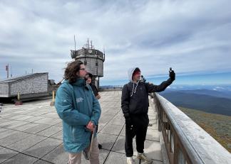 Caption: Francis Tarasiewicz, Mount Washington Observatory weather observer and education specialists, provides guidance to an Alvirne High School student on Friday. 