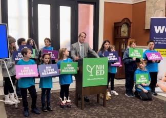 CAPTION: Commissioner Frank Edelblut of the New Hampshire Department of Education joins students from the Boys and Girls Club of Central New Hampshire to announce the launch of New Hampshire’s Statewide Reading Campaign on Wednesday at the State Library in Concord. 
