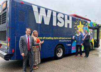 From left, Commissioner Frank Edelblut, Nashua Assistant Superintendent of Elementary Education Kimberly Sarfde, Nashua Assistant Superintendent for Secondary Education Matthew Poska and Nashua Superintendent Mario Andrade help promote New Hampshire’s love of reading while touring one of the Manchester Transit Authority buses displayed with NHED’s mobile advertising.