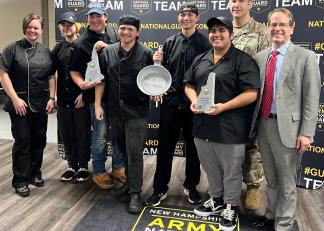 Students from Dover Regional Career Technical Center are presented with first-place awards for the MRE Challenge and snack competition during the Granite Skillet Challenge final competition last week in Laconia.